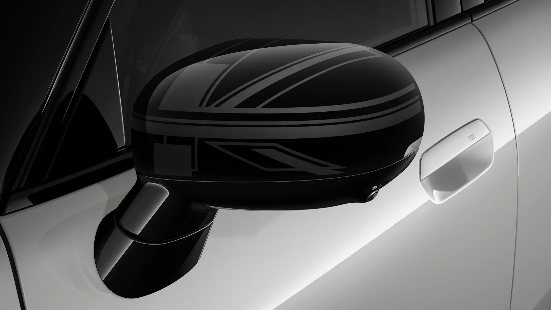 3-drzwiowe MINI Cooper w kolorze srebrnym z zewnętrznymi nakładkami na lusterka boczne w stylu Night Union Jack.