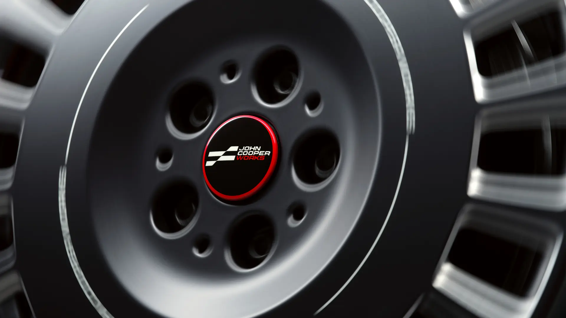 Nieruchomy dekielek piasty koła John Cooper Works, który nie obraca się wraz z kołem, ale pozostaje w pozycji poziomej podczas jazdy. 